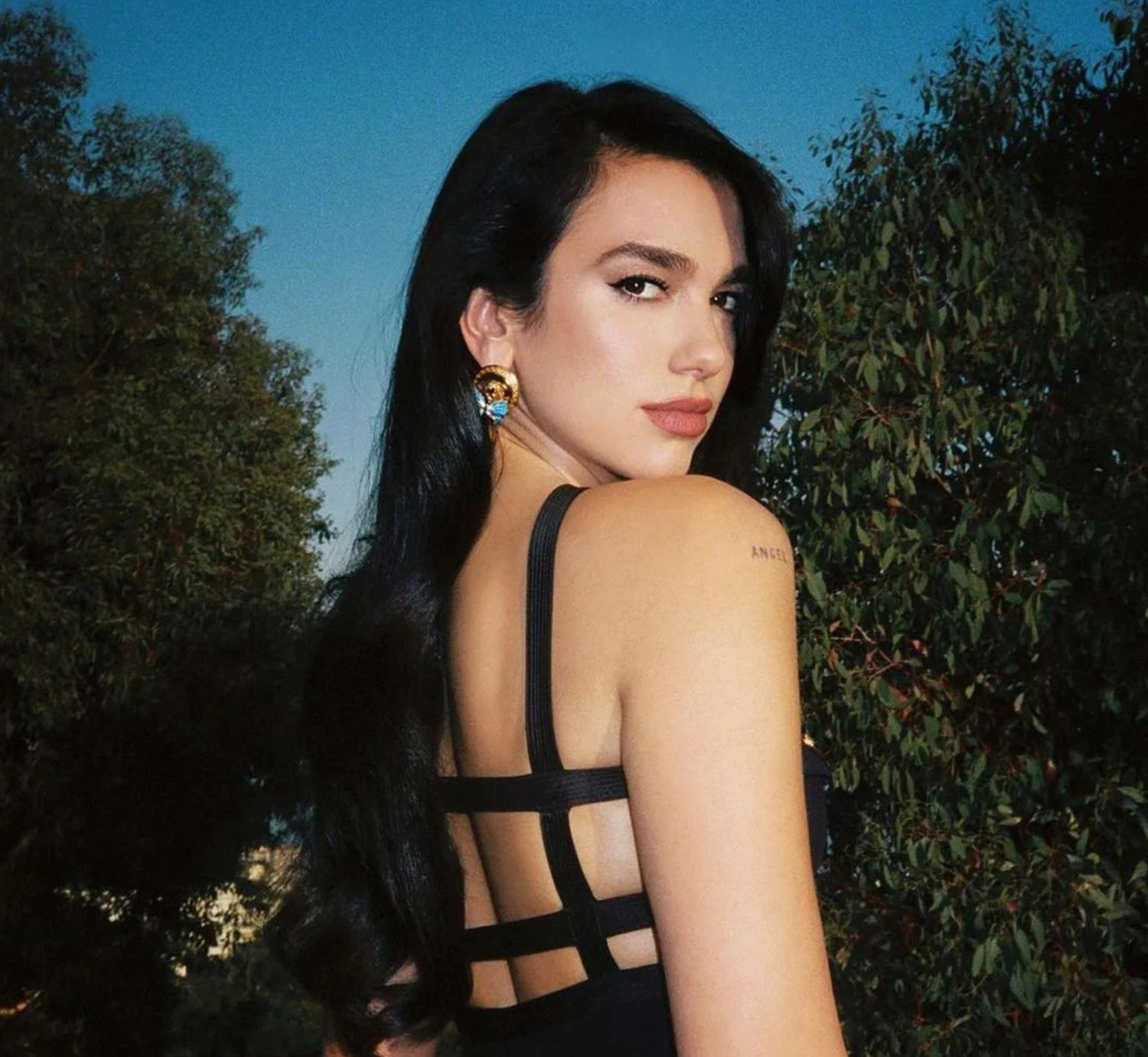 Dua Lipa with side part